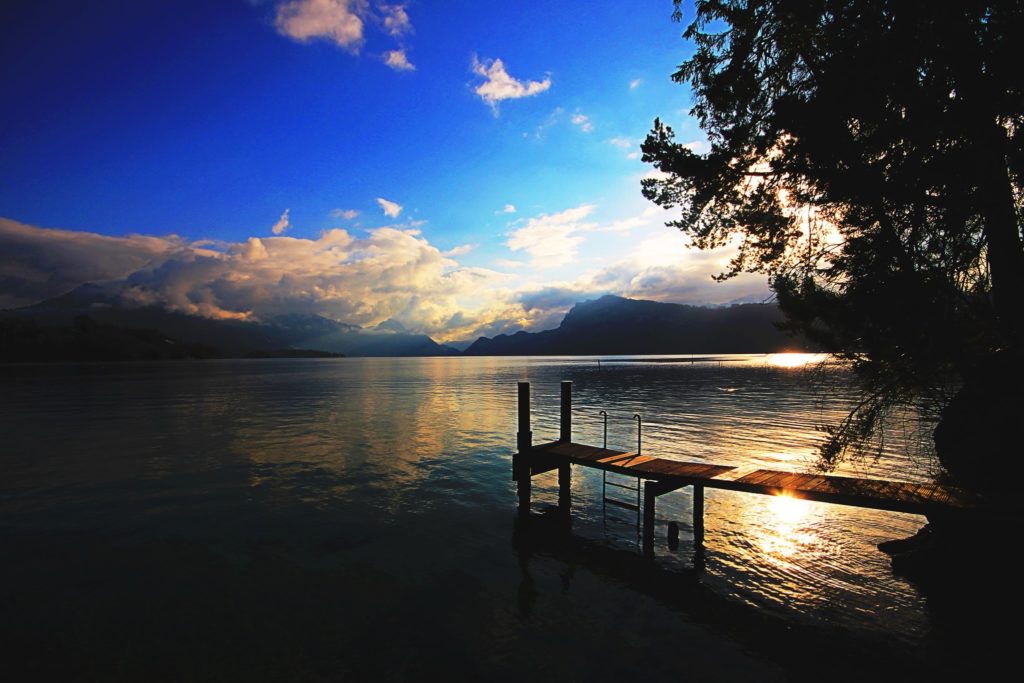 Revel in serenity: Your private jetty awaits, with the majestic Mount Rigi standing guard in the distance.